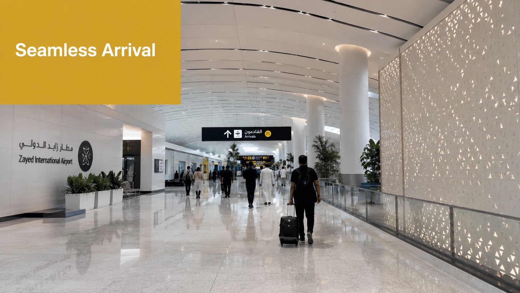 Passengers walking through the modern, spacious, and bright arrivals terminal of Zayed International Airport in Abu Dhabi.