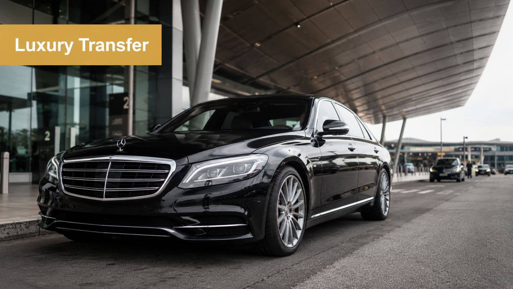 A black Mercedes-Benz luxury sedan parked in front of a modern airport terminal building for private transport.