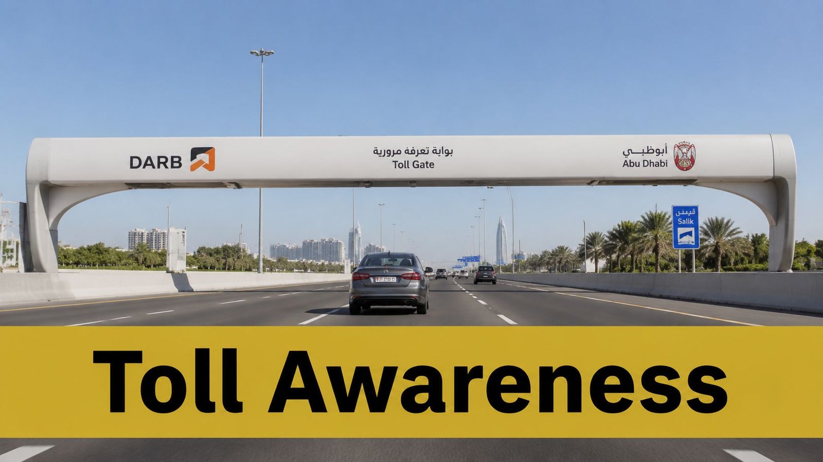 A car driving under a Darb toll gate structure on a highway in Abu Dhabi, United Arab Emirates.